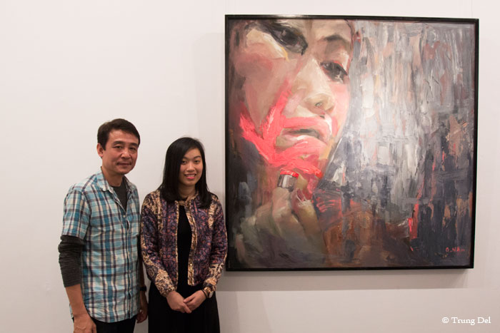 Artist Nguyen Quynh Na and curator Tran Luong and Na's artwork "Stranger" (2014, oil on canvas)